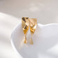 Boucles d'oreilles dorées rectangle tourné