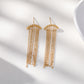 Boucles d'oreilles dorées chaînes pendantes