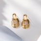 Boucles d'oreilles dorées arrondies pendantes