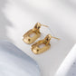 Boucles d'oreilles dorées arrondies pendantes