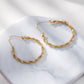 Boucles d'oreilles dorées créoles ondulées