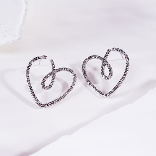 Boucles d'oreilles argentées cœur à strass