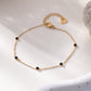 Bracelet chaîne avec 5 strass noirs