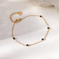 Bracelet chaîne avec 5 strass noirs