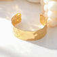 Wide hammered bangle bracelet