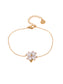 Bracelet chaîne dorée avec fleur en strass