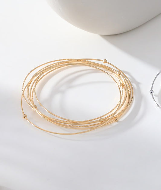 Multi bracelets joncs fins dorés