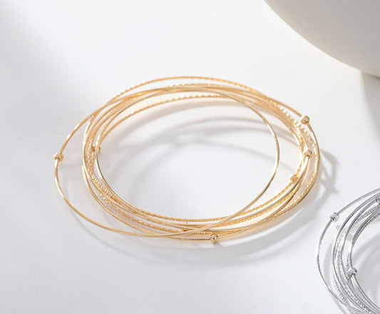 Multi bracelets joncs fins dorés