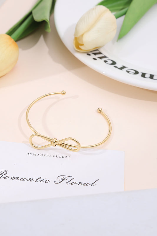 Bracelet jonc fin doré noeud avant