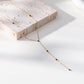 Collier doré en Y avec strass noirs