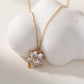 Collier chaîne dorée avec pendentif fleur à strass