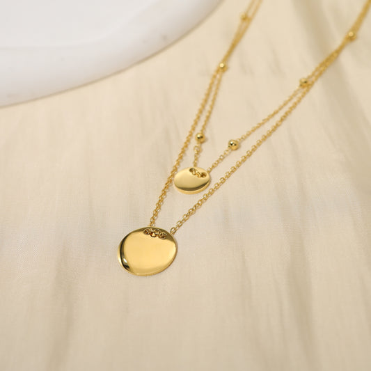 Collier double chaîne avec pendentifs ronds