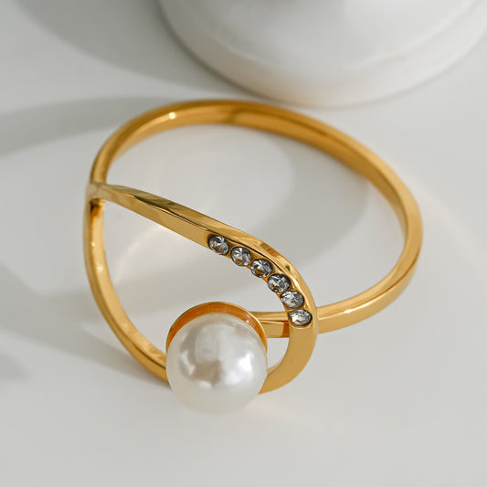 Bague dorée ligne avec perle synthétique et stras