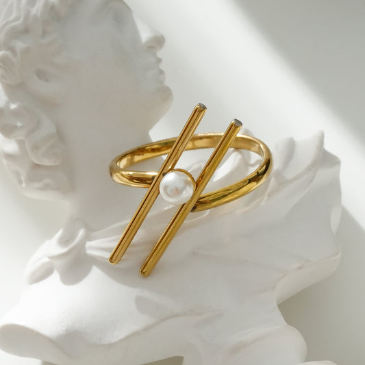 Bague Dorée Double Barres Obliques Avec Perle