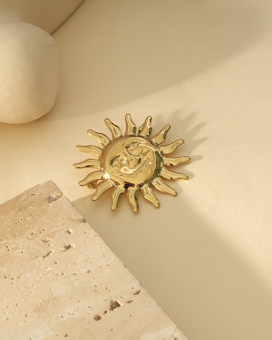 Broche Dorée Soleil Brillant Texture Visage