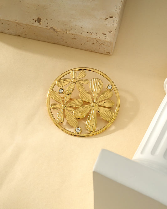 Broche Dorée Triple Fleurs Ornées de Strass Avec Cadre Rond