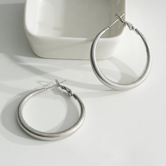 Boucles d'Oreilles Argentées Créoles Motifs Ressorts