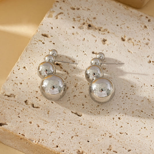 Boucles d'Oreilles Argentées Avec Quadruple Boules