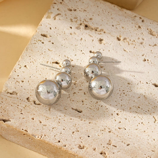 Boucles d'Oreilles Argentées Avec Quadruple Boules