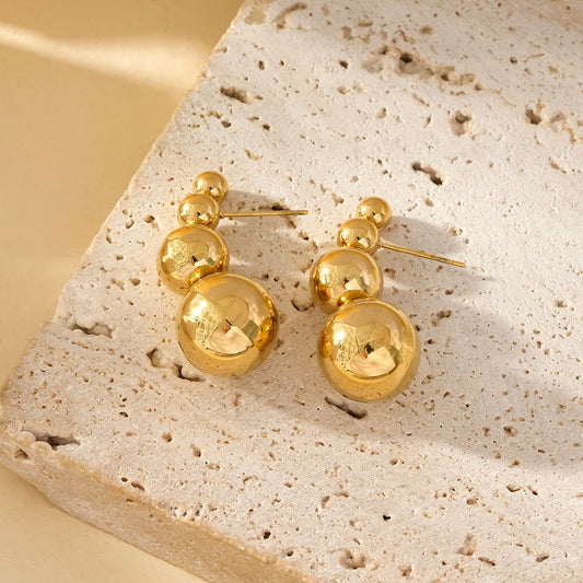 Boucles d'Oreilles Dorées Avec Quadruple Boules