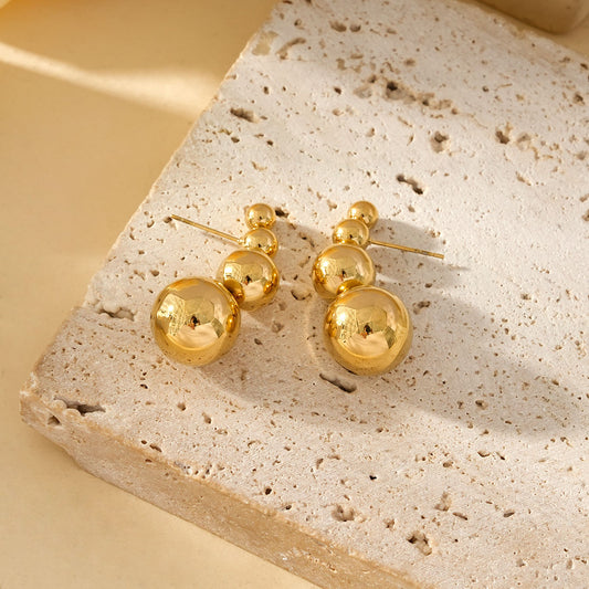 Boucles d'Oreilles Dorées Avec Quadruple Boules