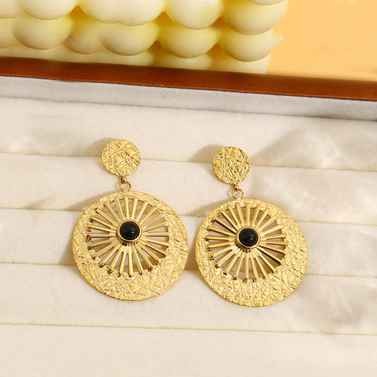 Boucles d'oreilles dorées pendantes avec pierre noir