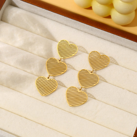 Boucles d'oreilles dorées triple cœurs