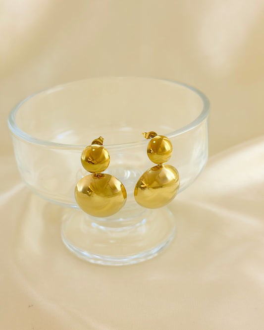 Boucles d'Oreilles Dorées Pendantes Double Boutons Brillants