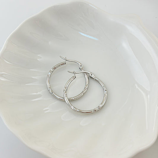 Boucles d'Oreilles Argentées Créoles Lisses Et Brillantes