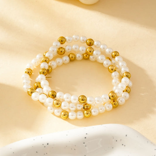 Trois Bracelet élastiques à Perles Blanches Et Dorées