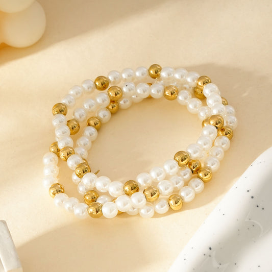 Trois Bracelet élastiques à Perles Blanches Et Dorées