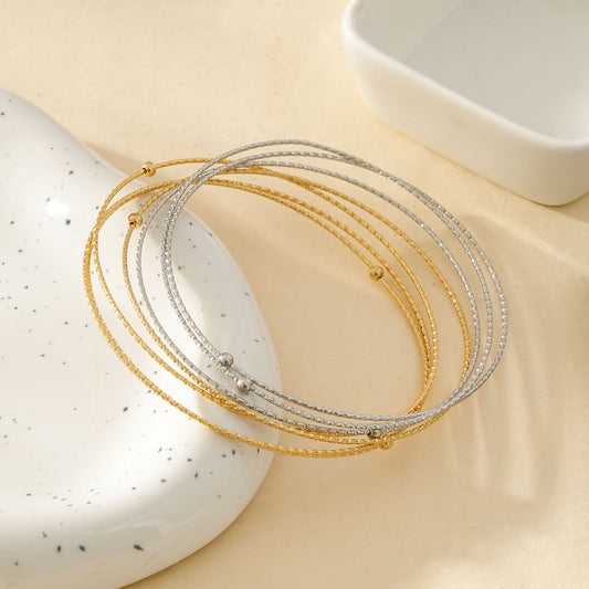 Bracelet Joncs Multiples Cercles Fins Dorés Et Argentés Ornées Boules