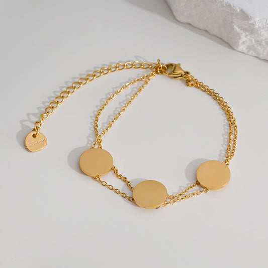 Bracelet doré double chaîne fine avec disque