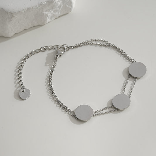 Bracelet argenté double chaîne fine avec disque