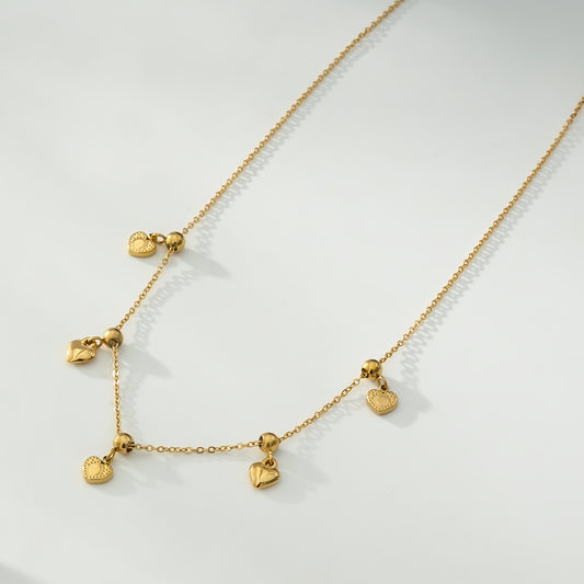 Collier Doré Multi Pendantes Cœurs Lisses Et Texturés