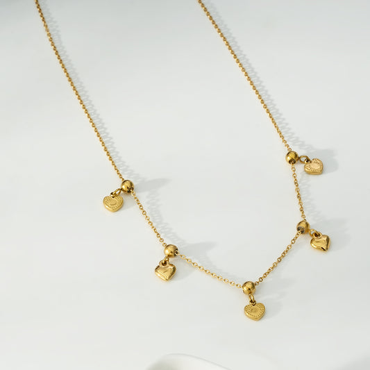 Collier Doré Multi Pendantes Cœurs Lisses Et Texturés