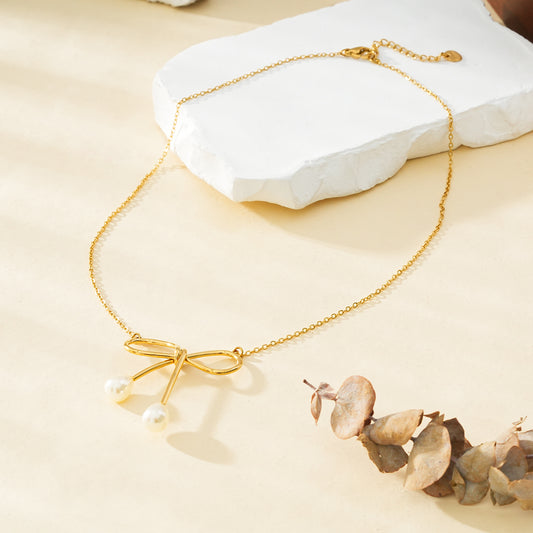 Collier Doré Grand Nœud Papillon Avec Perles Sur Pointes