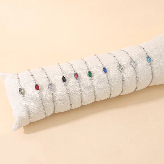 Lot de 12 Bracelets Argentés Avec Pierre Ovale Colorée Sur Coussin