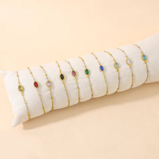 Lot de 12 Bracelets Dorés Avec Pierre Ovale Colorée sur Coussin