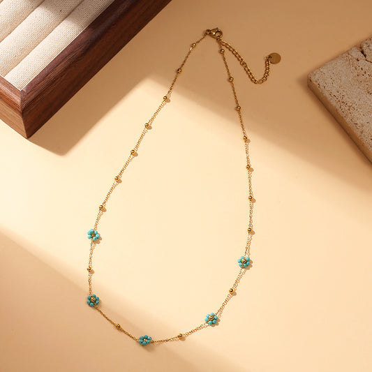 Lot de 6 colliers fleurs colorés sur présentoir