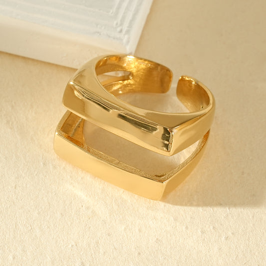 Bague dorée ouverture aarière à double barre rectangulaire bombée séparée par un espace