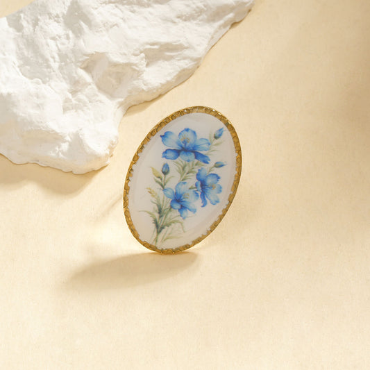 Bague ovale avec fleur bleue