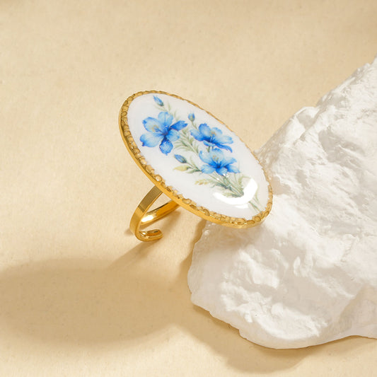 Bague ovale avec fleur bleue