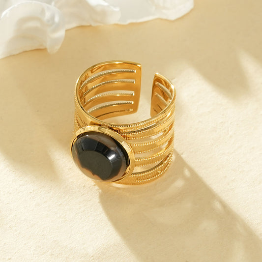 Bague dorée ajustable 6 branches texturées pierre centrale léopard résine