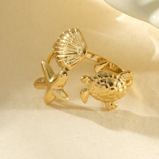Bague dorée ajustable coquillage, étoile de mer et tortue