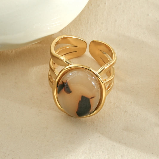 Bague dorée triple branches pierre ovale résine léopard