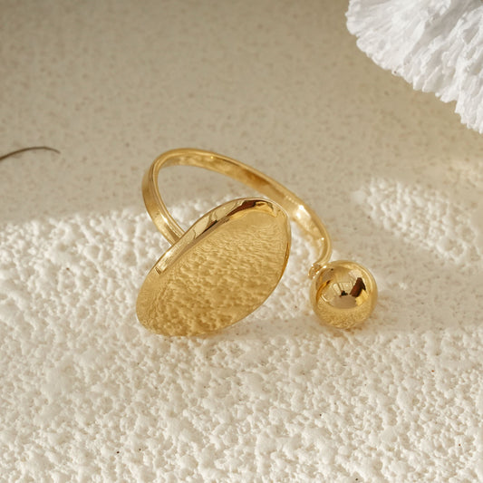 Bague Dorée Ouverte Avec Sphère Et Disque