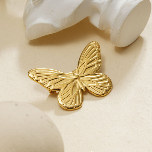Broche aimantée dorée papillon