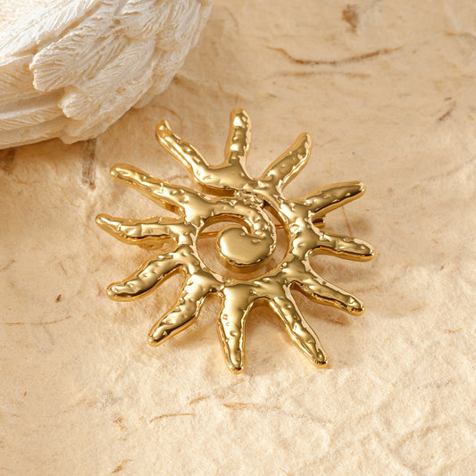 Broche soleil spirale