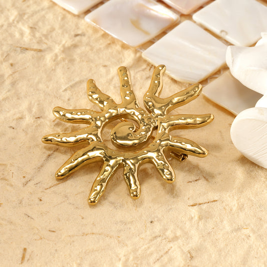 Broche soleil spirale